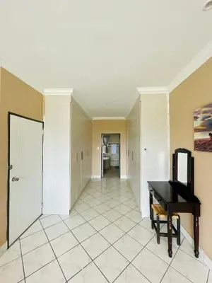 a room with a piano and a hallway at The Yacht House in Hartbeespoort