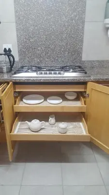 a stove top oven sitting in a wooden cabinet at Julie's B&B in White River
