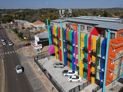 an overhead view of a building with colorful facade at Next To Apartment Hotel in Pretoria