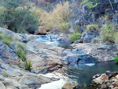 a stream of water on the side of a mountain at The Hank Maribashoek Adventure Lodge in Mokopane