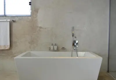 a white bath tub in a bathroom with a window at Augusta Palms - White Room in Centurion