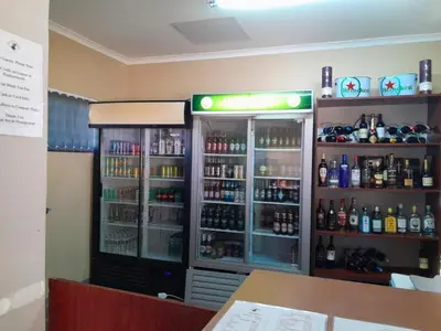 a store with a lot of bottles of alcohol at Mogale Royal Gardens in Polokwane