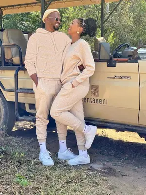 a man and a woman standing next to a truck at Sofala Lodge in Mokopane