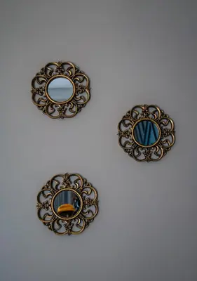 a group of three mirrors on a wall at 703 Menlyn Maine Residences, The Trilogy in Pretoria