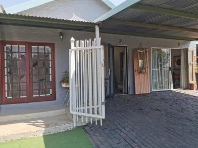 a white gate in front of a house at SomethingElz@Grace in Pretoria