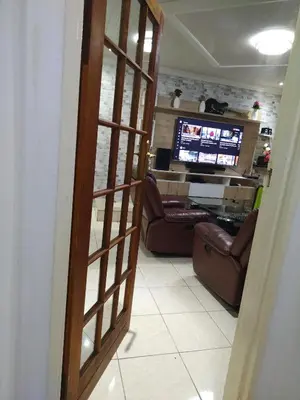a view of a living room with a television at Cheers in Evander