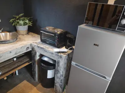 a kitchen with a white refrigerator and a microwave at Vulture's View 8 in Hartbeespoort
