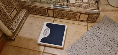 a clock sitting on the floor of a building at My House Guest House in Pretoria
