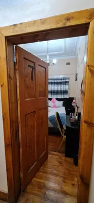 an open door to a bedroom with a bed at My House Guest House in Pretoria