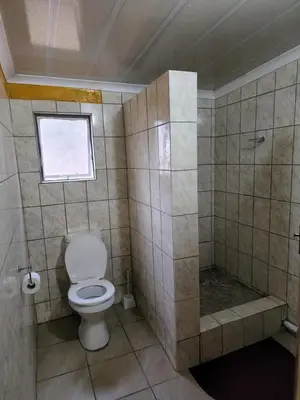 a bathroom with a toilet and a shower at WAMPEX GUEST HOUSE IN NORTHAM CBD 239 COAL STREET in Northam