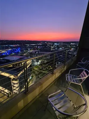 a couple of chairs sitting on top of a building at Top Floor Penthouse - Overlooking Times Square Casino in Pretoria