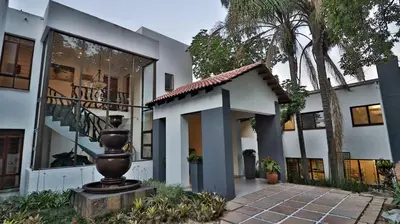 a building with a statue in front of it at Khayalami Hotel - Mbombela in Nelspruit