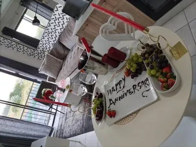 a kitchen with a table with fruit on it at Taina Apartment @ Green Creek in Pretoria