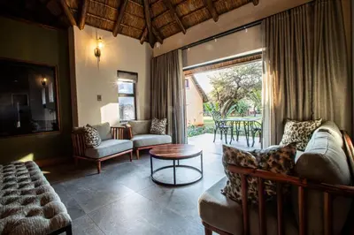a living room with a couch and a table at Lapeng Guest Lodge in Burgersfort