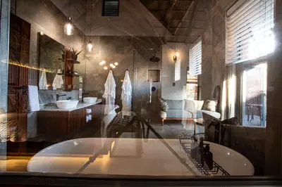 a large bathroom with a tub in a room at Lapeng Guest Lodge in Burgersfort