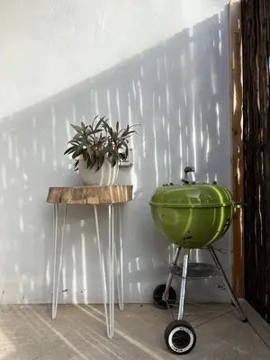 a bathroom with a green sink and a plant on a table at Pan's Breeze Overnight Accommodation in Dalmada AH