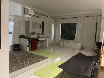 a large bathroom with a sink and a tub at Royal Views in Hartbeespoort