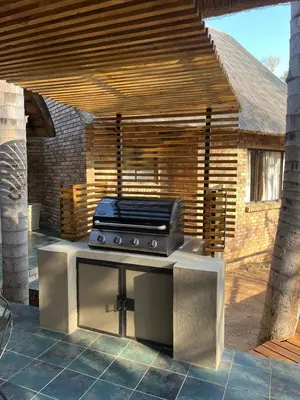 a grill sitting on a table in a patio at Fish Eagle Villa in Hoedspruit