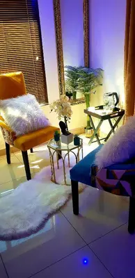 a living room with a couch and a table at Ko-Porch luxury guest house in Polokwane
