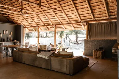 a large living room with a couch and a table at Thaba eNtle Private Boutique Game Farm in Thabazimbi