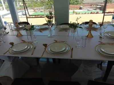 a white table with plates and utensils on it at Tony Hill Manor House in Shirley