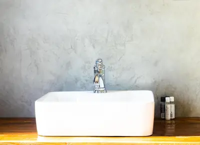 a white sink with a faucet on top of it at Maratongfontein Euphoria Villa in Naboomspruit