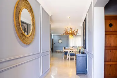 a hallway with a mirror and a dining room at Maratongfontein Euphoria Villa in Naboomspruit