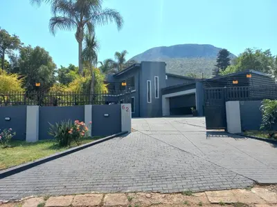 a modern house with a driveway at Chasba Airbnb in Hartbeespoort