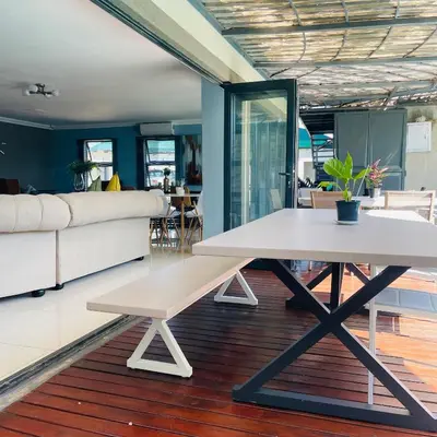 a living room with a table and a couch at Mo'Acress Lifestyle in Temba