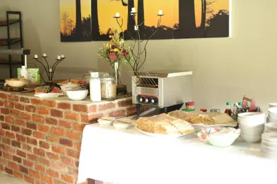 a counter with bread and a toaster oven on it at Waterberg Game Lodge in Bela-Bela
