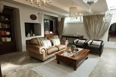 a living room with a couch and a coffee table at 55 Tulbagh events and wedding venue in Kempton Park
