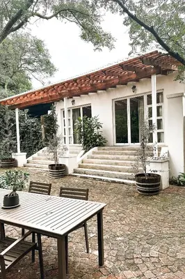 a house with a picnic table in front of it at 55 Tulbagh events and wedding venue in Kempton Park