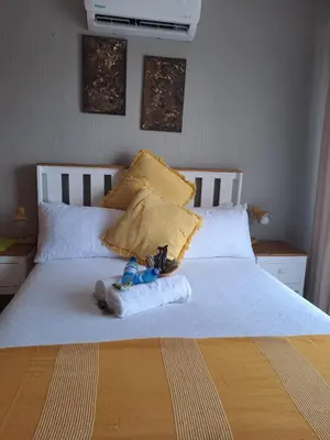 a stuffed animal sitting on top of a bed at Christa's Place 899 in Pretoria
