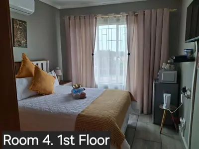 a bedroom with a bed with a teddy bear on it at Christa's Place 899 in Pretoria