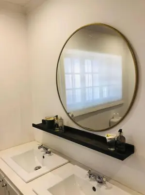 a bathroom with a sink and a large mirror at Cipresso Guesthouse in Tierpoort