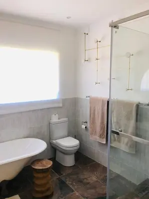 a bathroom with a toilet and a sink and a shower at Cipresso Guesthouse in Tierpoort