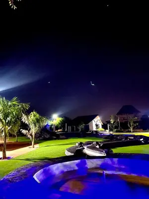 a view of a golf course at night at Bluewave Farm Villa in Louis Trichardt