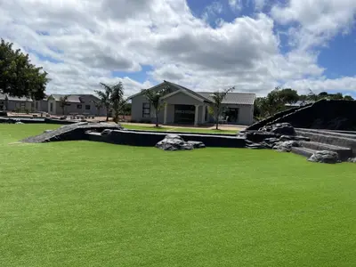a yard with green grass and a skate park at Bluewave Farm Villa in Louis Trichardt