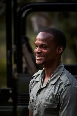 a man smiling while sitting on a bus at Letamo at Qwabi Private Game Reserve by NEWMARK in Bela-Bela