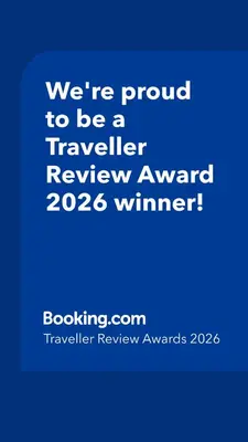 a blue sign that says were proud to be a traveller reviewagency winner at Eye of Kruger - Spacious holiday home with splash pool and boma in Marloth Park