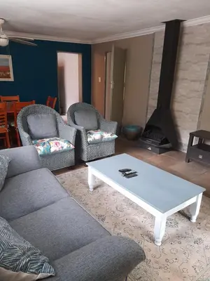 a living room with a couch and a coffee table at Hawkshead Lodge in Alkmaar