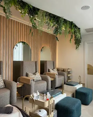 a living room with couches and tables and plants at Ellipse Apartment in Midrand