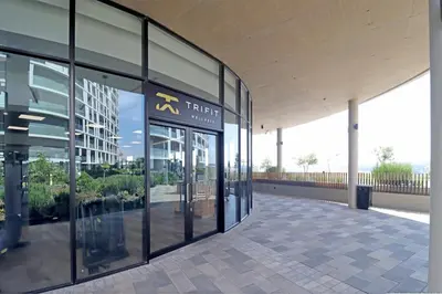 an entrance to a building with glass doors at Ellipse Apartment in Midrand