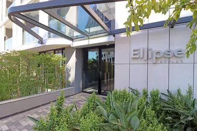a building with the entrance to an office at Ellipse Apartment in Midrand