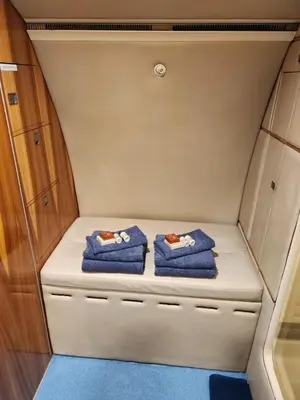 two blue towels sitting on a shelf in a small room at AEROTEL VIP in Hoedspruit