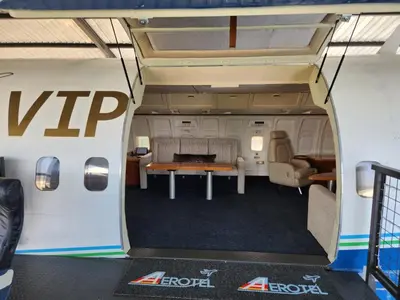 an interior view of an rv with a table and chairs at AEROTEL VIP in Hoedspruit