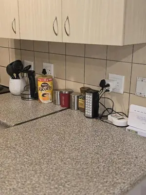 a counter in a kitchen with a bunch of appliances at The Retreat, Midrand - 2bed 2bath in Midrand