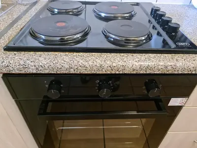 a stove top with four burners on it in a kitchen at The Retreat, Midrand - 2bed 2bath in Midrand