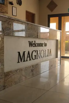 a welcome sign at the entrance to macarolilla at Magnolia Hotel in Middelburg