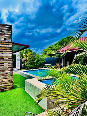 a swimming pool in the yard of a house at Executive Galaxy Guest House Nkowankowa in Nkowakowa